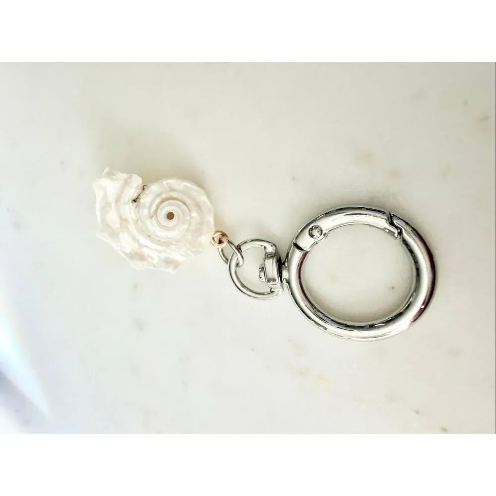 Pearlescent with silver color seashell keychain